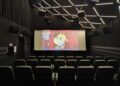 Kauno kino centro „Romuva“ salė su ekrane rodomu animaciniu filmu