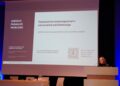 Kernavės konferencijoje Vaidutė Ščiglienė skaito pranešimą apie UNESCO pasaulio paveldo apsaugą